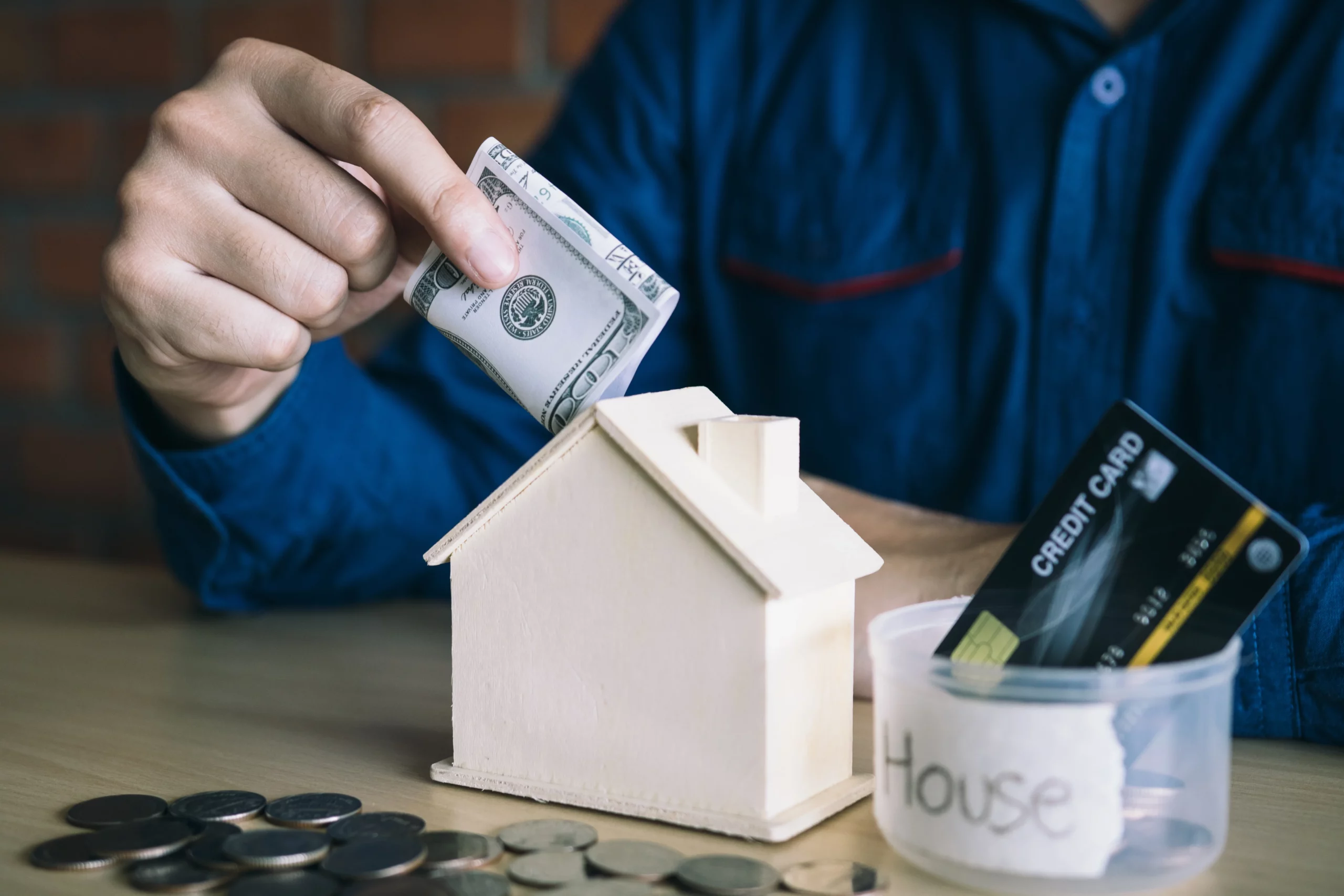 Person saving money to protect their home from foreclosure through Chapter 13 bankruptcy in Tennessee