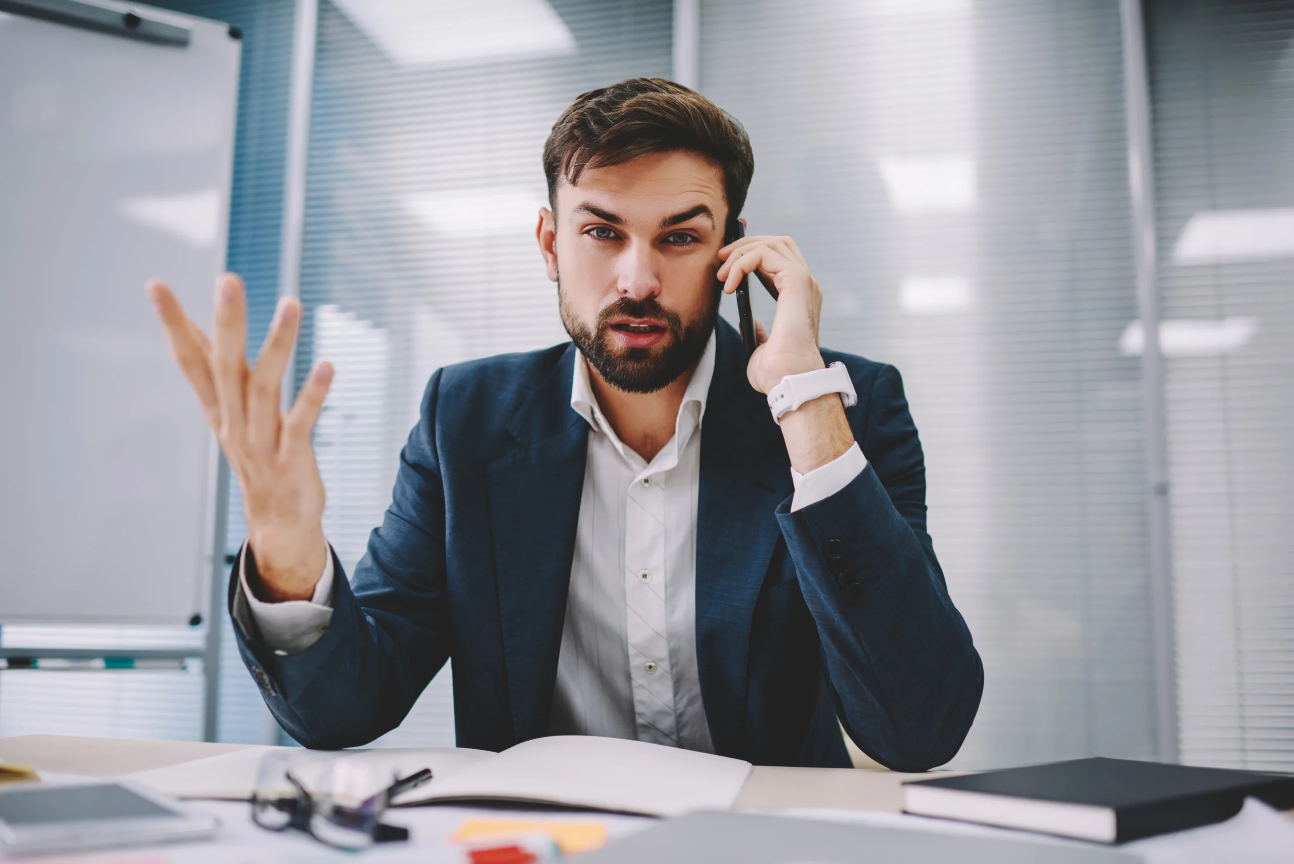 Businessman speaking with a debt collector about creditor harassment and debt in Tennessee